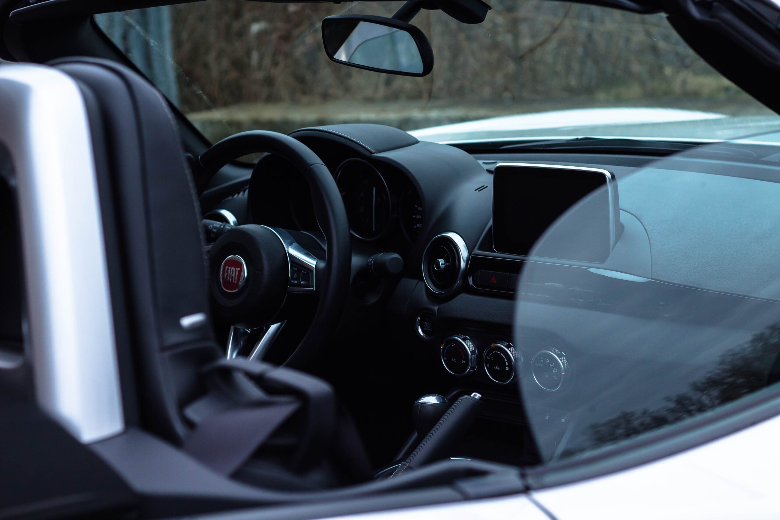a shot of a car interior looking through the window.